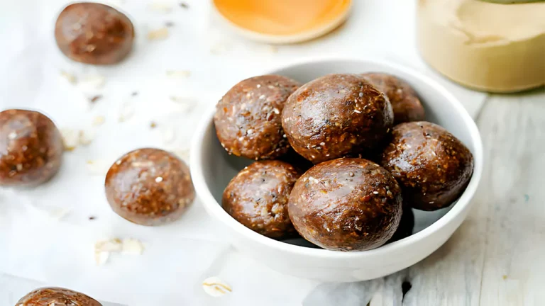 Assorted ingredients including peanut butter, chocolate chips, and Rice Krispies, arranged for making peanut butter balls.