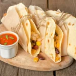 Colorful and inviting baked chicken tacos on a vibrant Mexican-themed background