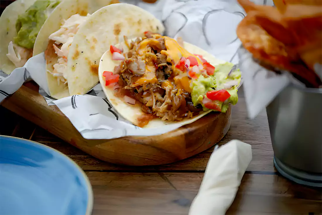 A vibrant table setting with freshly baked tacos ready to be served