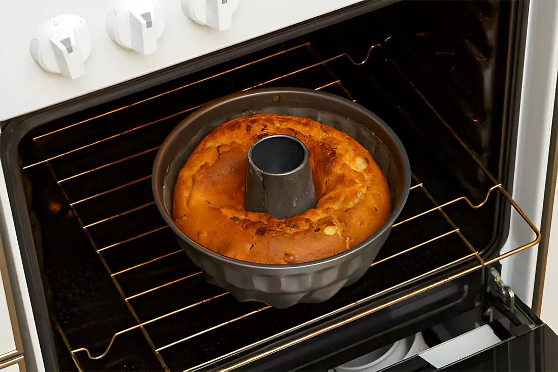 Bundt pan inside an oven, illustrating the baking process