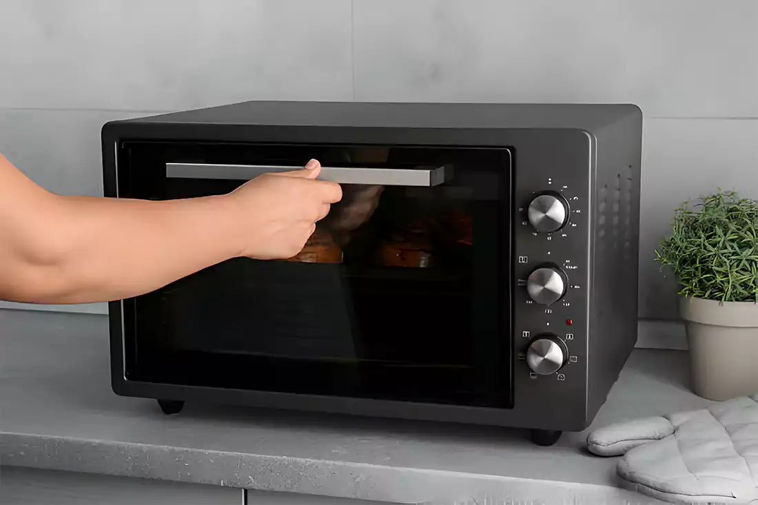 Chicken wings being reheated using different methods including oven, air fryer, and microwave