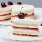 An elegantly presented Maraschino Cherry Cake on a serving plate