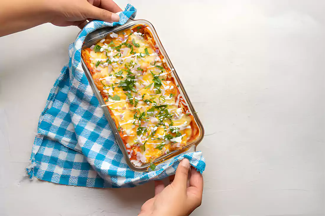 Crispy golden baked tacos in an oven tray