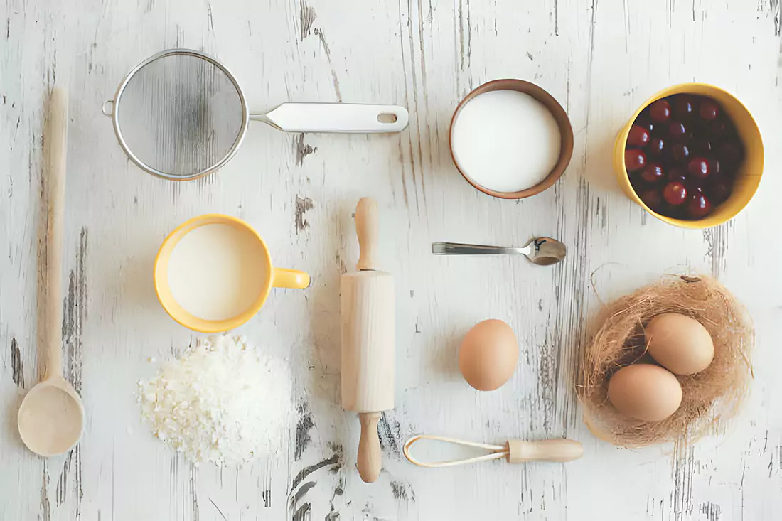 Key ingredients for baking Maraschino Cherry Cake including cherries, flour, and eggs