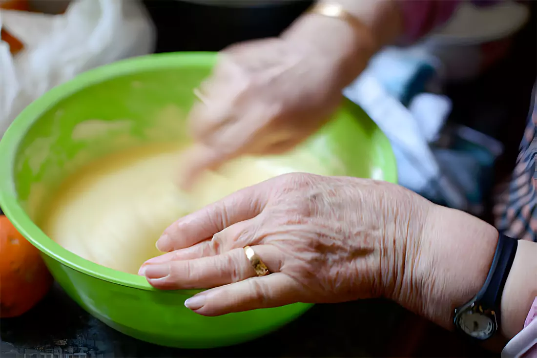 preparing orange fluff dessert in kitchen