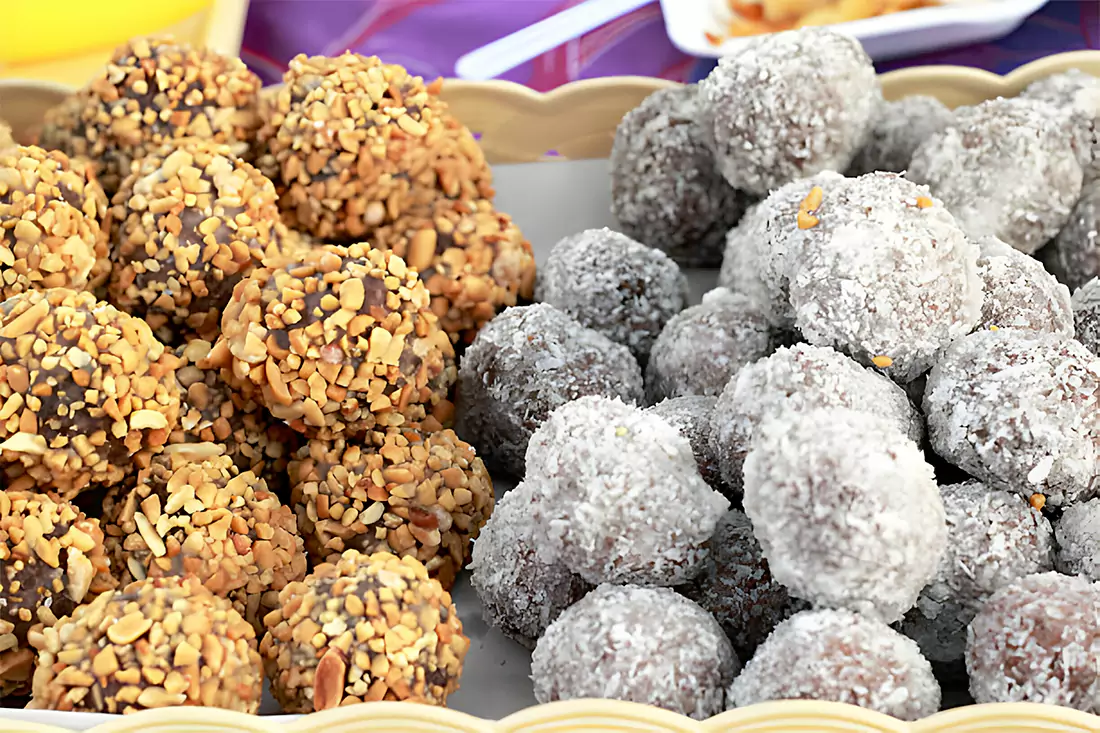 Rice Krispie Peanut Butter Balls arranged on a party table