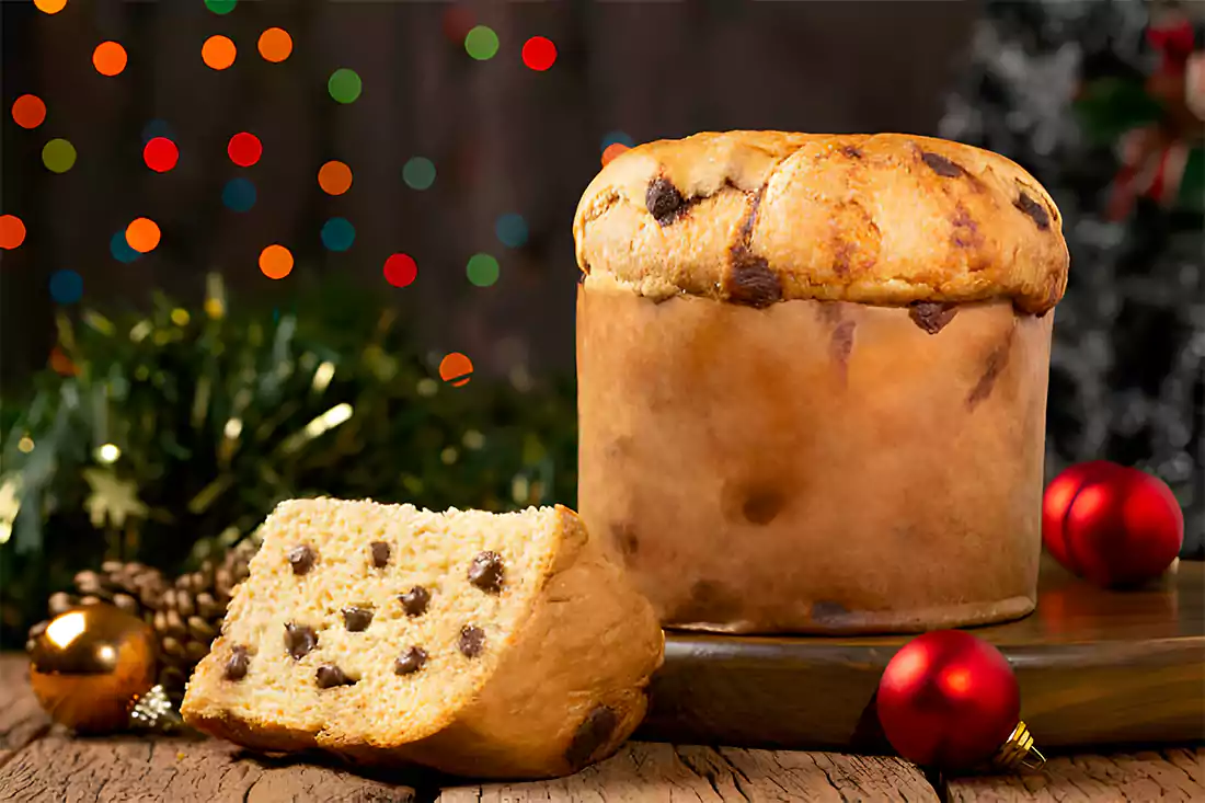 Baker preparing artisan Panettone dough in a kitchen setting