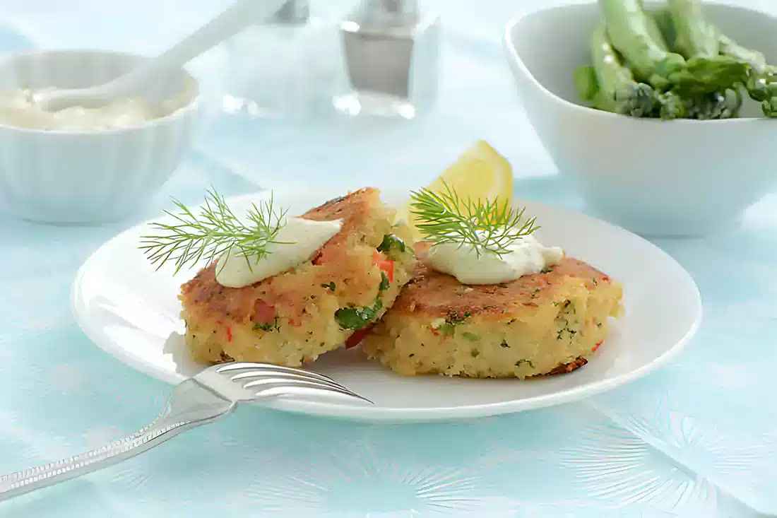 Delicious golden brown crab cakes served on a white plate, ready to eat