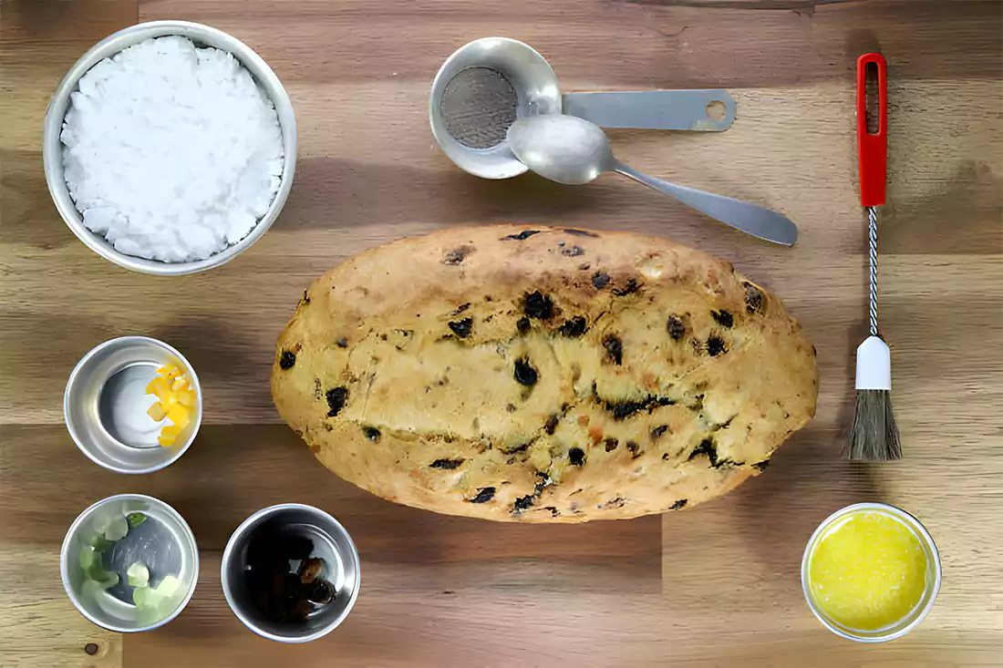 Assorted ingredients for panettone recipe on wooden table