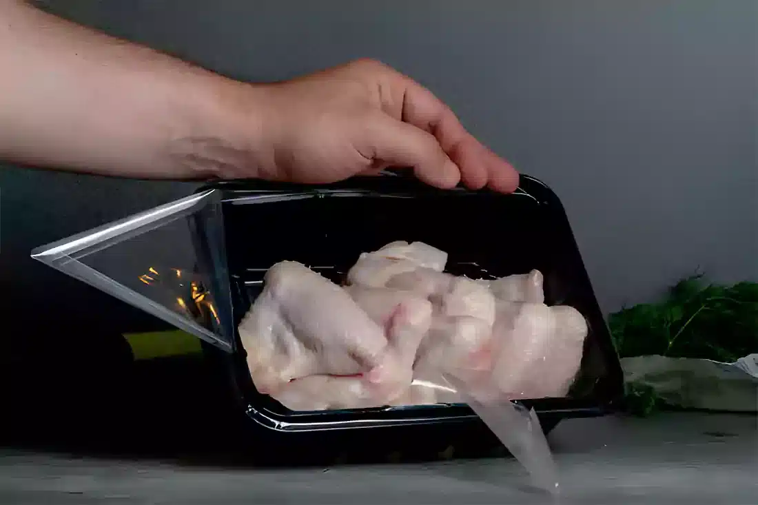 Preparing chicken wings safely in a clean kitchen environment