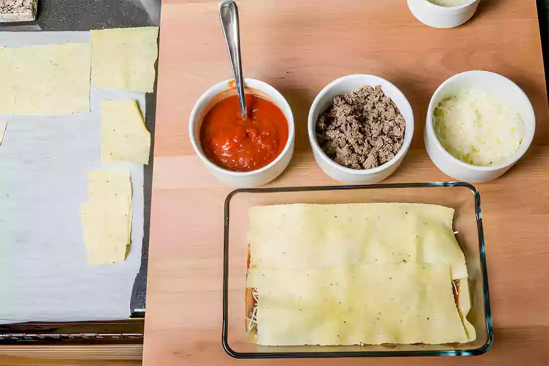 Taco shells in the oven, showcasing the detailed process of baking for perfect crispiness.