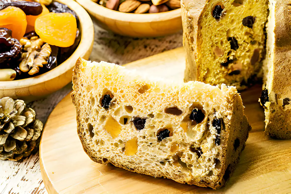 Traditional Panettone bread on a festive holiday background with decorations