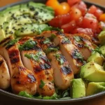 rilled Chicken & Avocado Salad Bowl with fresh greens, grilled chicken, avocado, and creamy dressing